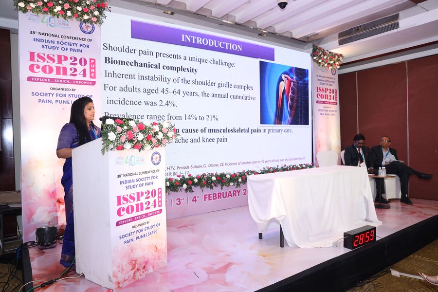 Dr. Kalpana K speaking at the podium of ISSPCON 2024, the 38th ISSP National Conference in Pune