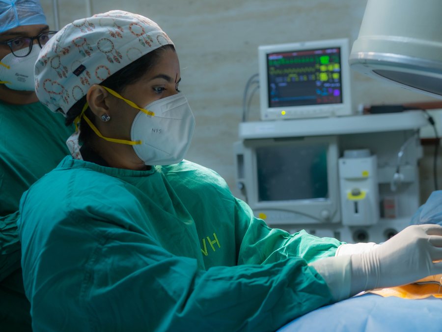 Dr. Kalpana K performing an image-guided pain procedure in the AIKYA operation theatre